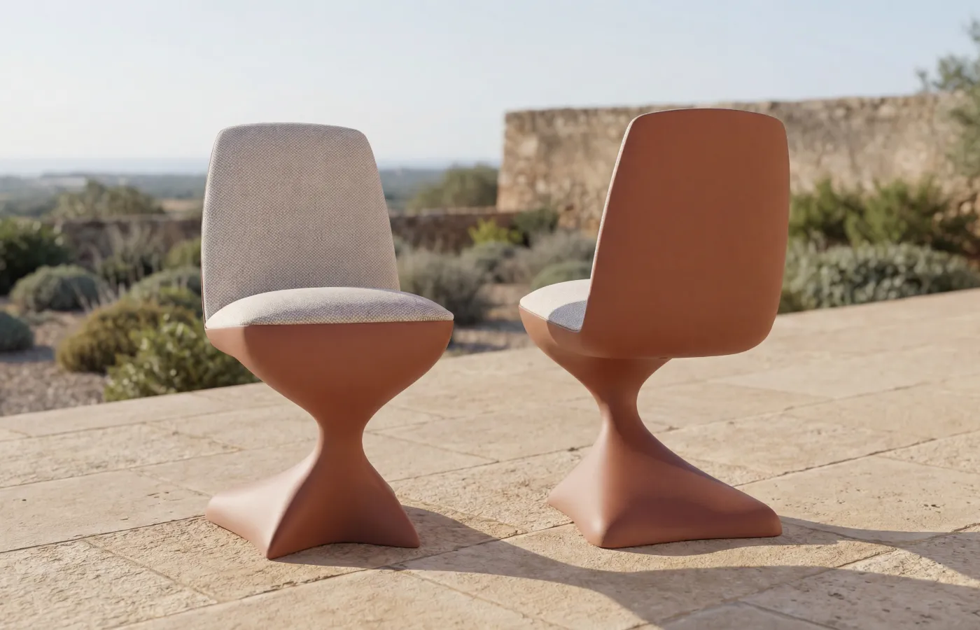 Alyna chairs in red on outdoor terrace with natural landscape in background.