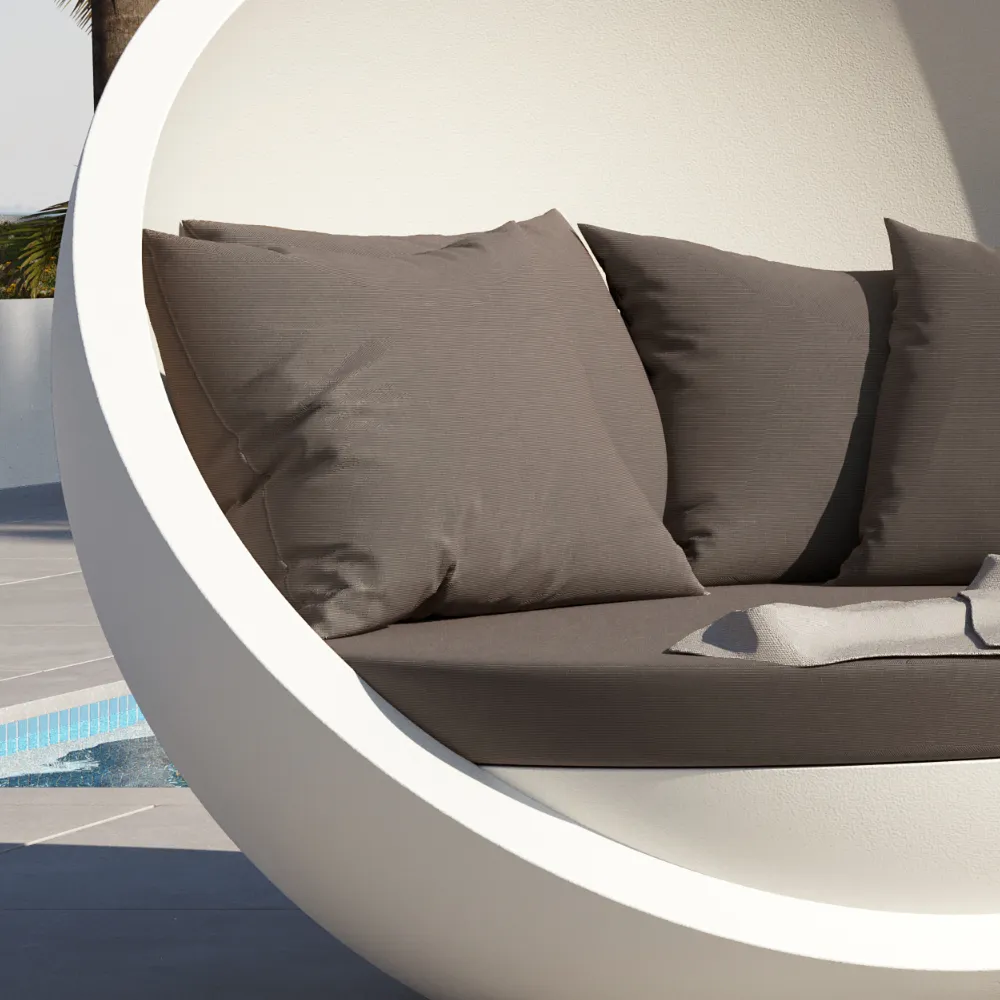 Close-up of the Bola outdoor sofa cushions and seat, showing fabric texture and inner curved shell.