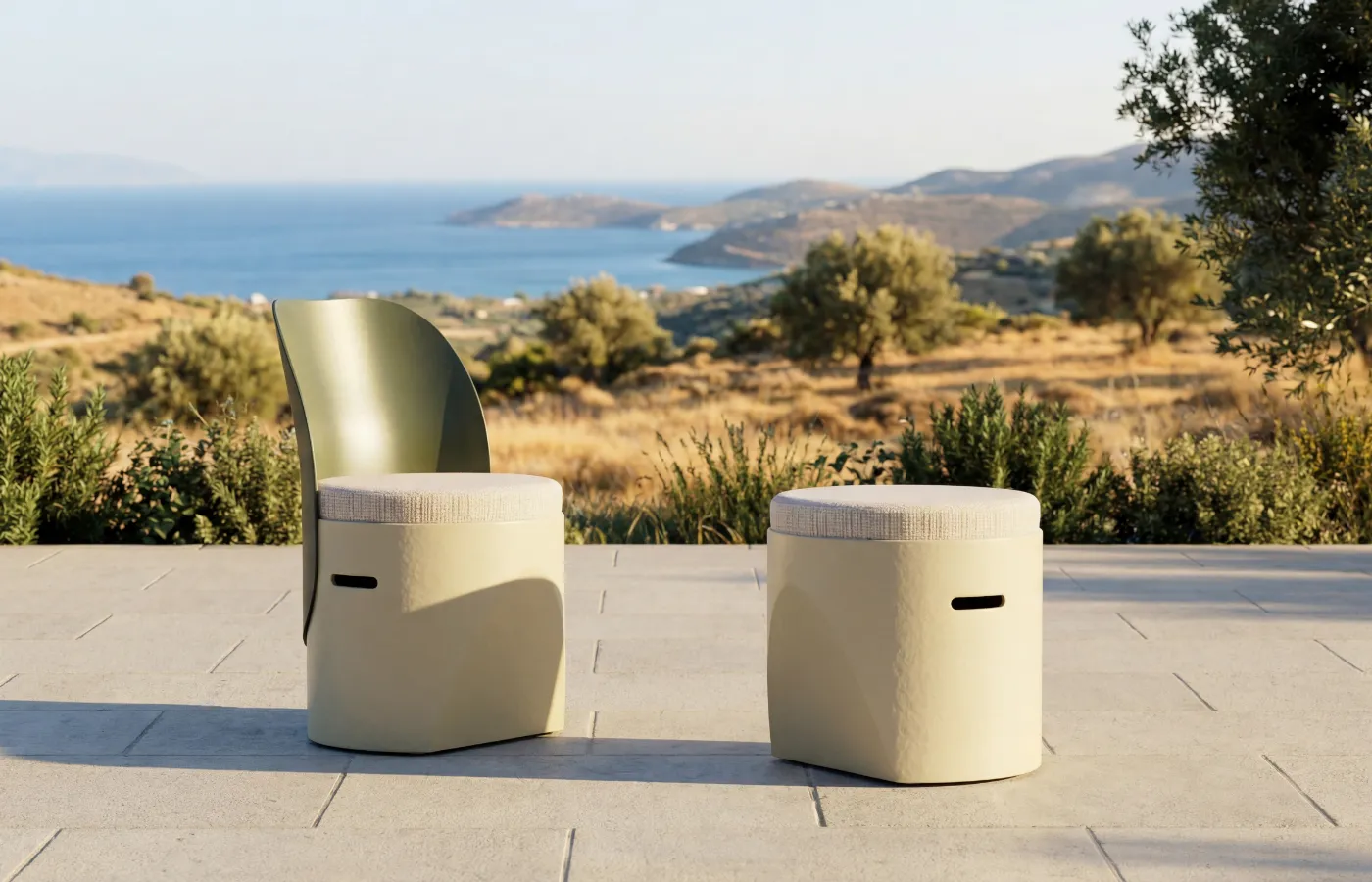 Cloe chair and stool in white on an outdoor terrace with sea views, highlighting compact volumes and cushioned seats.