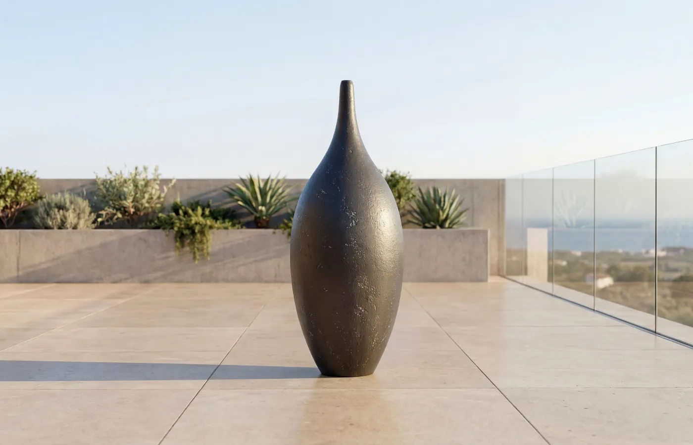 Gentle giant planter on an outdoor terrace, with a tall elongated shape and slate textured surface.