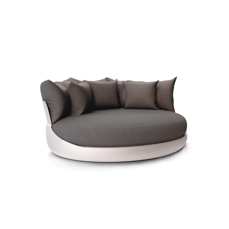 Daybed Harmony em branco com base circular e almofadas envolventes, apresentada sobre fundo neutro.