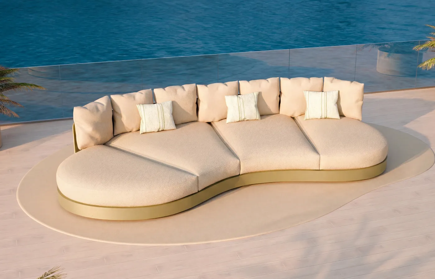 Sofá curvo Harmony em verde em terraço com vista mar, com almofadas claras e base orgânica.