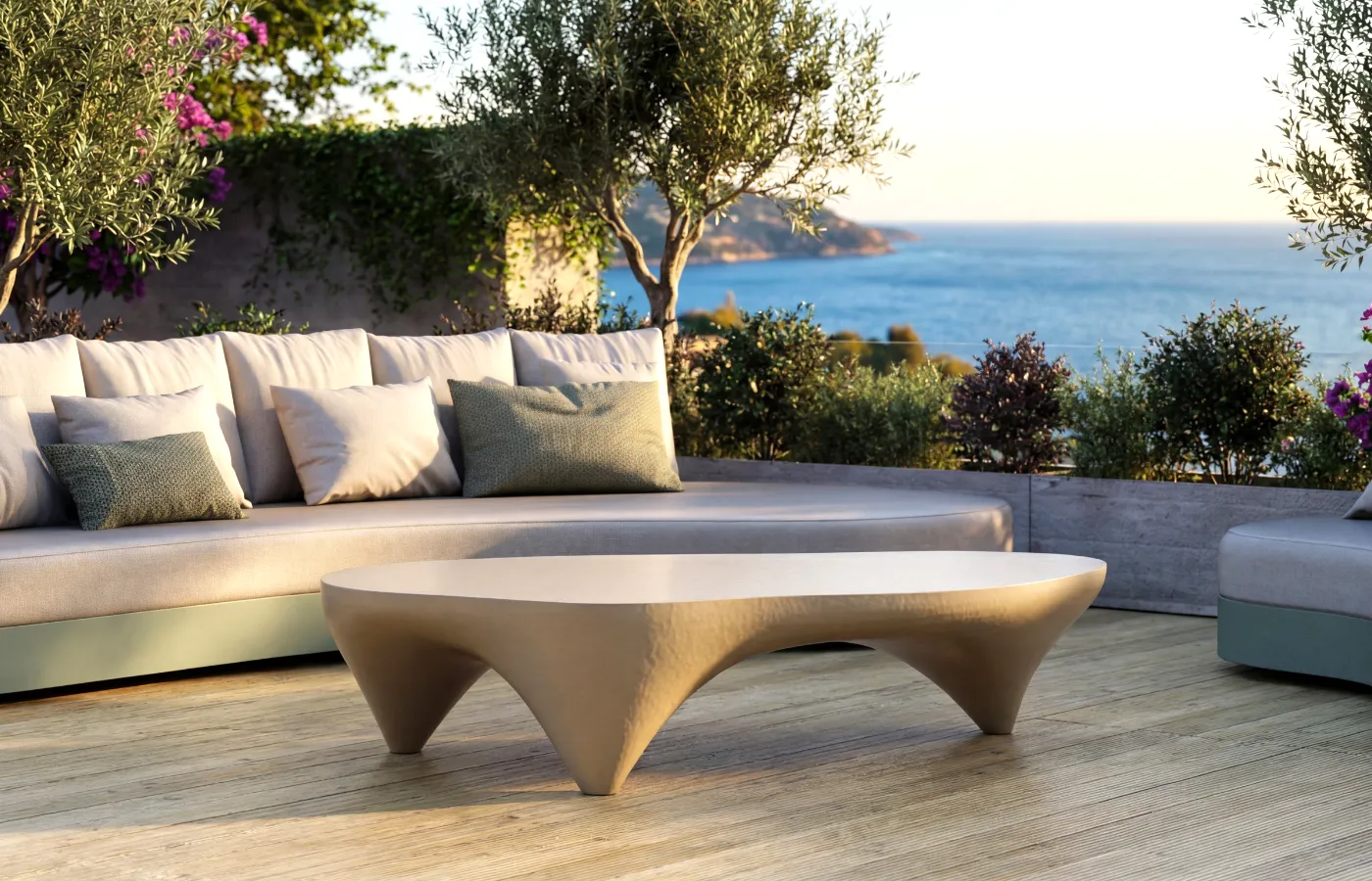 Ivory outdoor coffee table in matte white, placed in front of a lounge Harmony sofa on a wooden deck with a sea view.