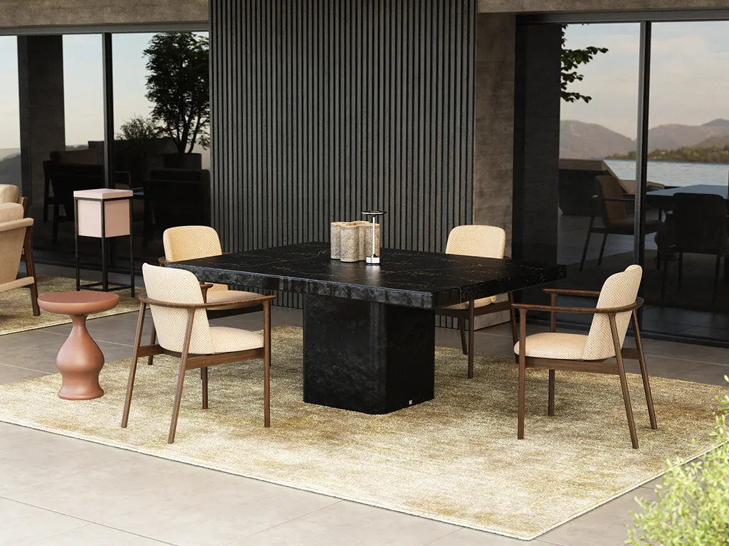 Lapidus outdoor dining table with a rectangular top and central block base in slate texture, surrounded by four chairs on a covered terrace.