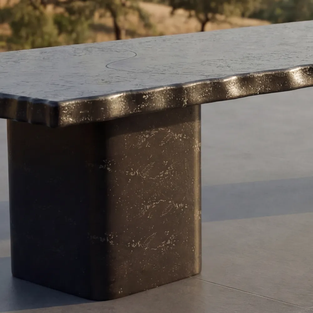 Detail of the Lapidus dining table, showing the slate texture with an irregular edge and block base.