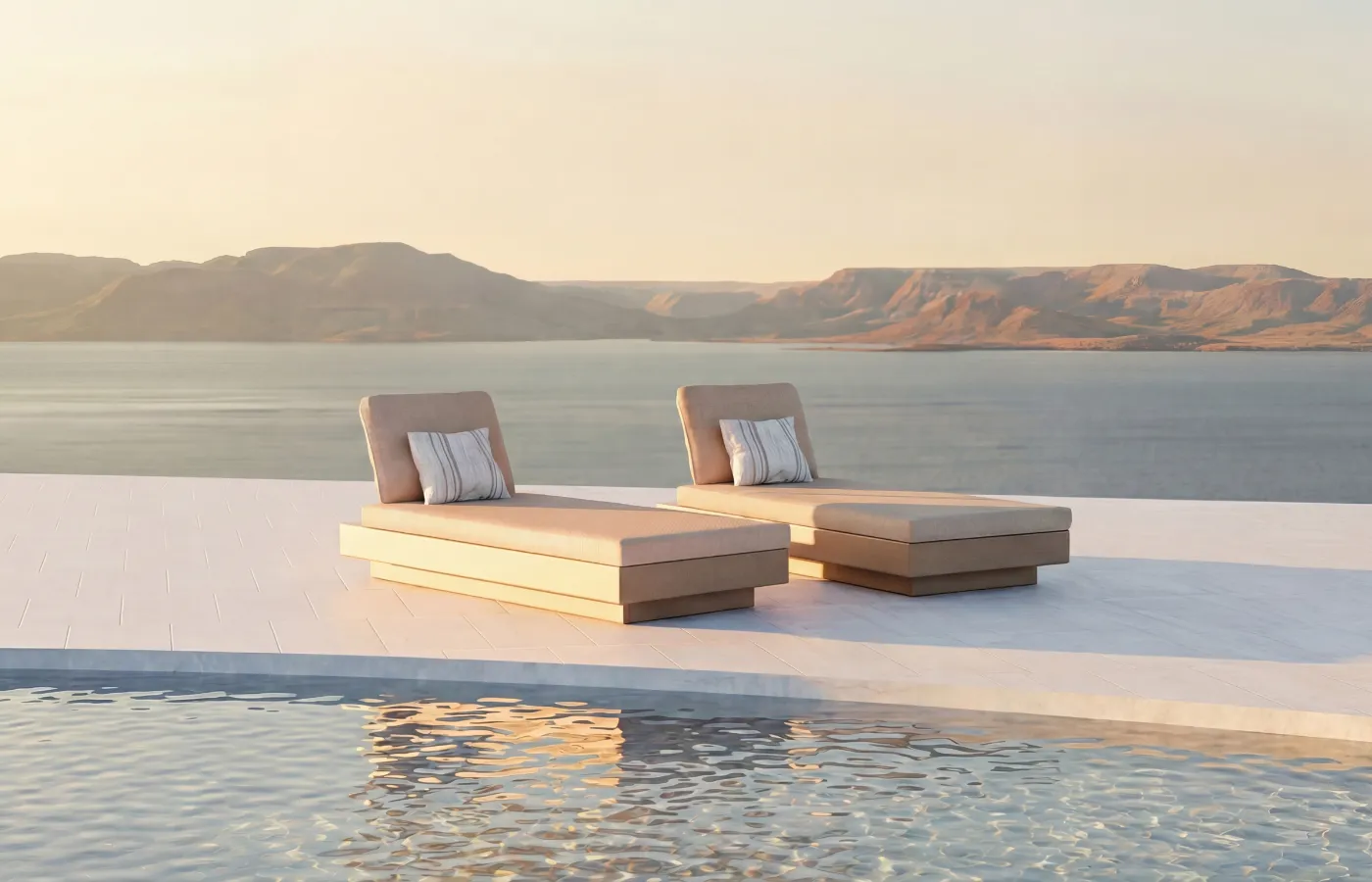 Nordic white pool beds arranged by the lake, with a straight base, cushioned mattresses and inclined backrests.