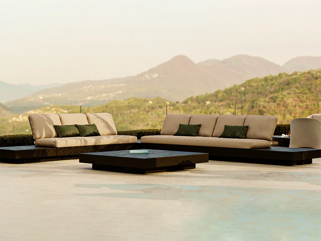 Nordic modular sofas arranged on a terrace with mountain view, featuring a volcanic texture base, light cushions and a Nordic coffee table.