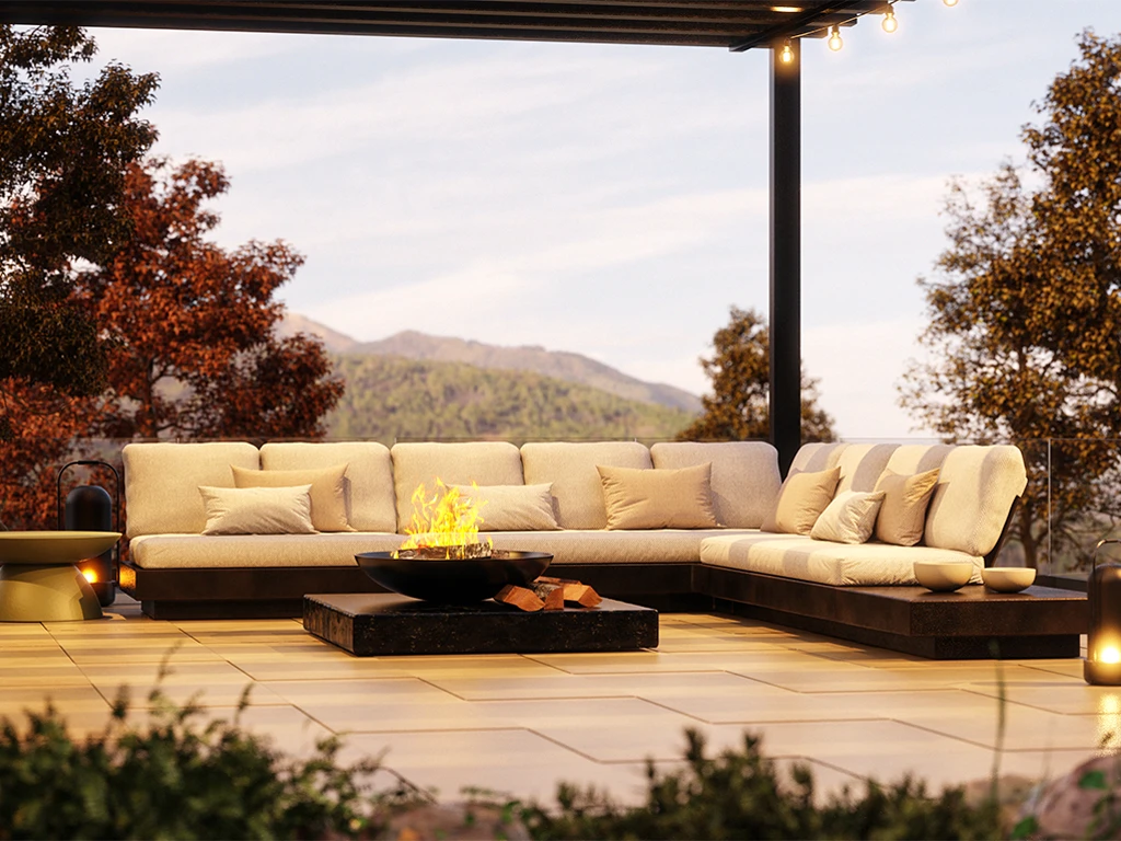 Nordic modular sofa in a corner arrangement, with a volcanic texture base, light cushions and a central fire table.