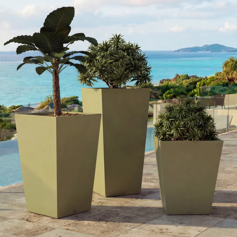 Close-up of Quadra small planters in different heights in green, with angular shapes and varied plants by the pool.