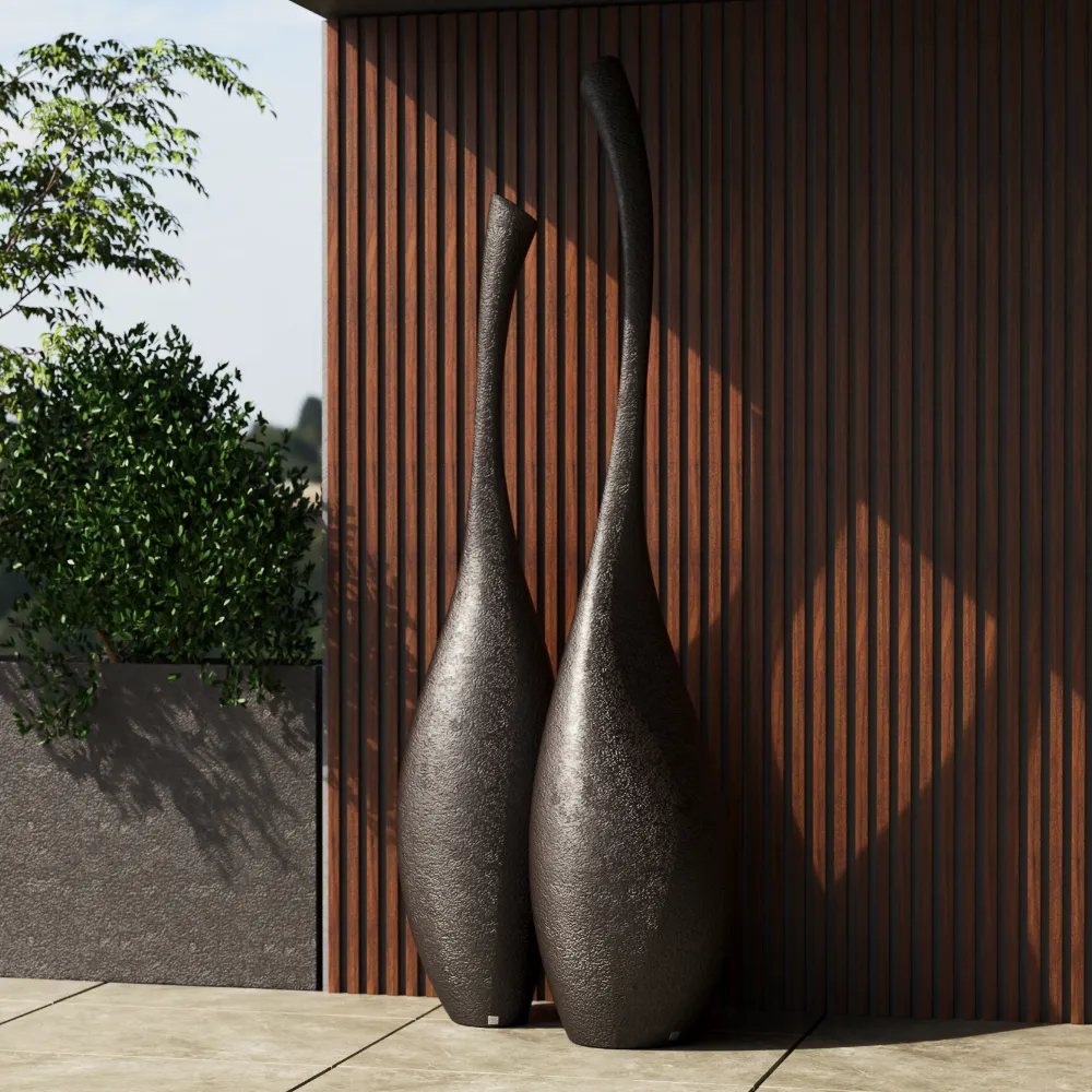 Close-up of the Solitary decorative pieces with elongated shapes and a volcanic textured surface beside a slatted wall.