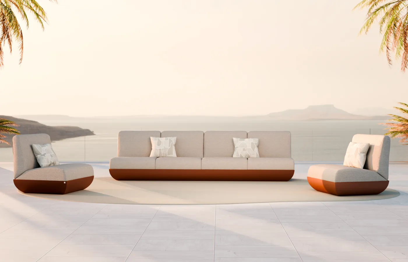 Sofás Victoria em vermelho, em composição exterior com vista mar, com módulos estofados e base arredondada contínua.