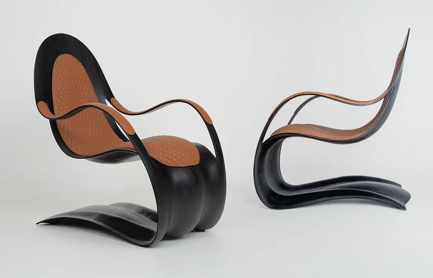 Side detail of GANSK’s Flex armchair with arched base and curved arms, highlighting its fluid silhouette and subtle rocking.