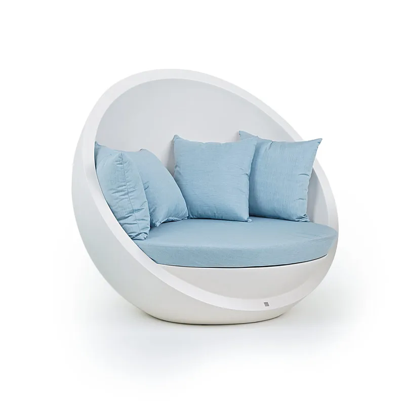 Bola sofa lacquered in white with blue cushion and pillows