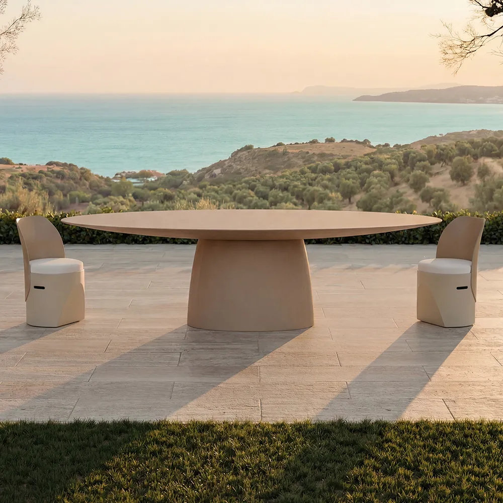 Outdoor terrace by the sea featuring a beige Magna dining table and Cloe chairs
